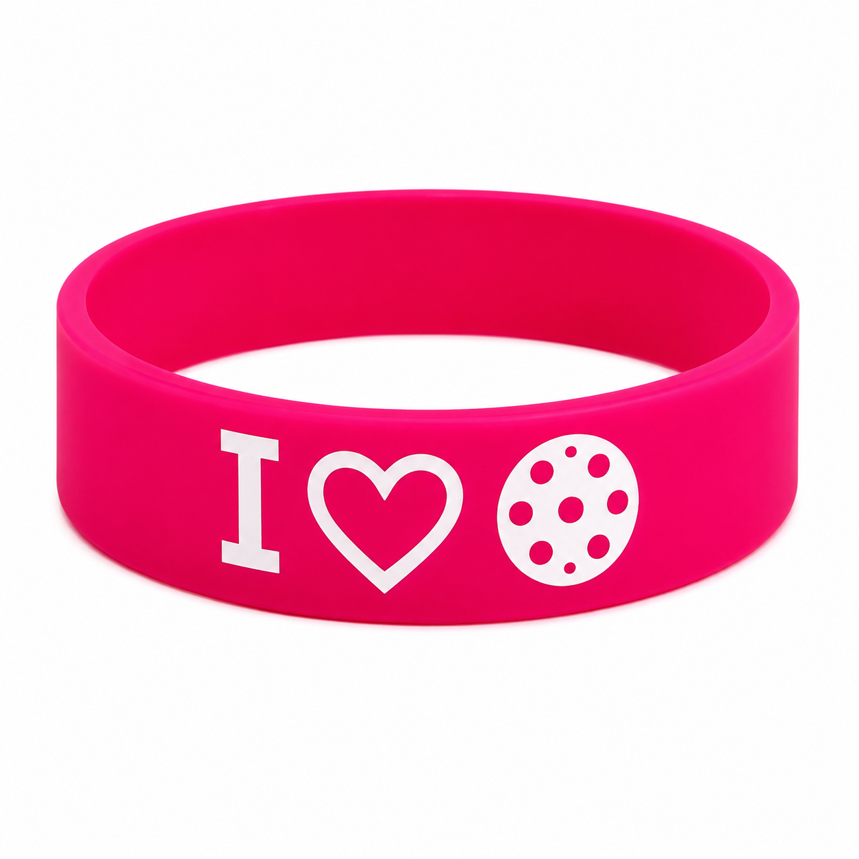 A bright pink silicone wristband featuring the white printed text and icons 'I' followed by a heart and a polka-dotted circle, shown on a plain white background.