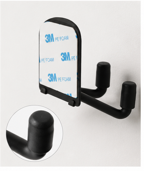 Adhesive backing and protective hook detail on wall-mounted pickleball paddle rack