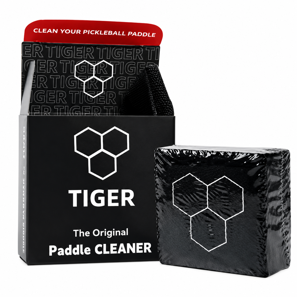 Tiger Paddle Cleaner packaging shown on a white background, including a black box with a red top flap and a wrapped black pad.