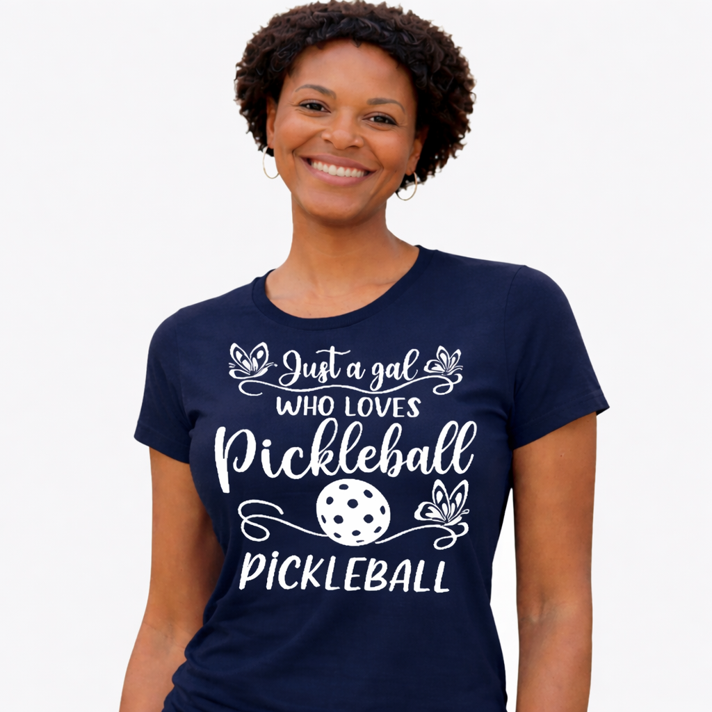Woman wearing a navy blue t-shirt with pickleball-themed text on a white background