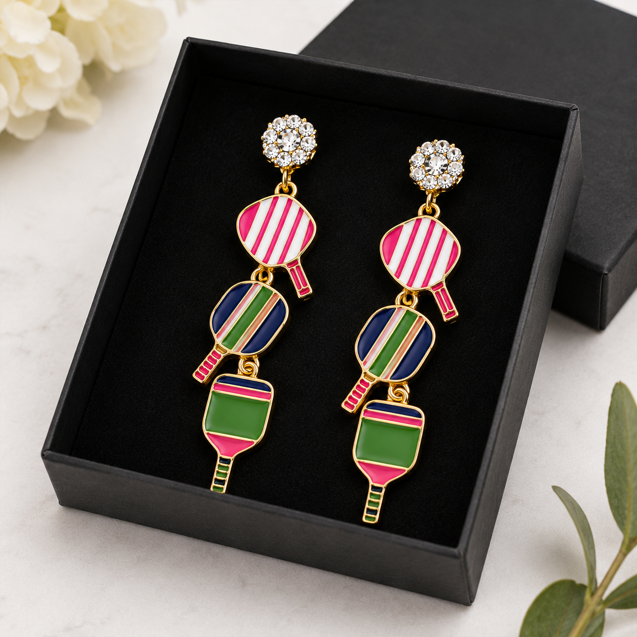 Triple-linked pickleball pearl earrings lifestyle close-up