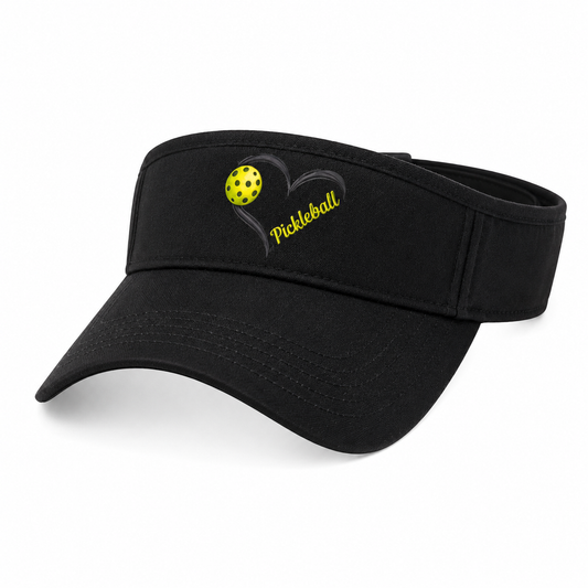 A black visor hat featuring a yellow pickleball and a black heart outline with the word 'Pickleball' embroidered on the front, set against a plain white background.
