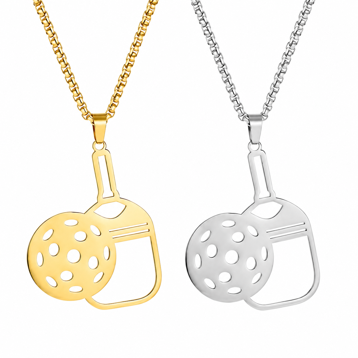 Two bicycle-themed pendant necklaces on chains, one in polished yellow gold and the other in polished silver, displayed side-by-side against a plain white background.