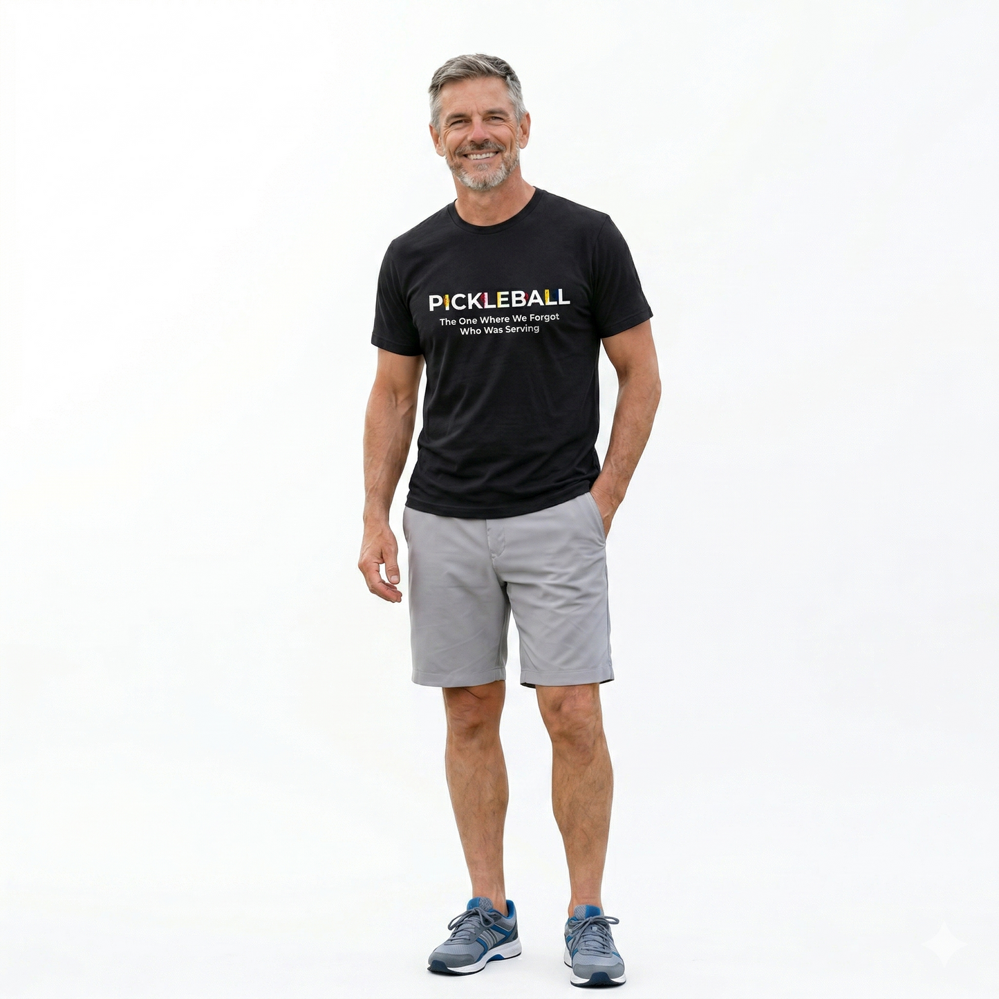 Man wearing a black pickleball t-shirt and gray shorts on a white background
