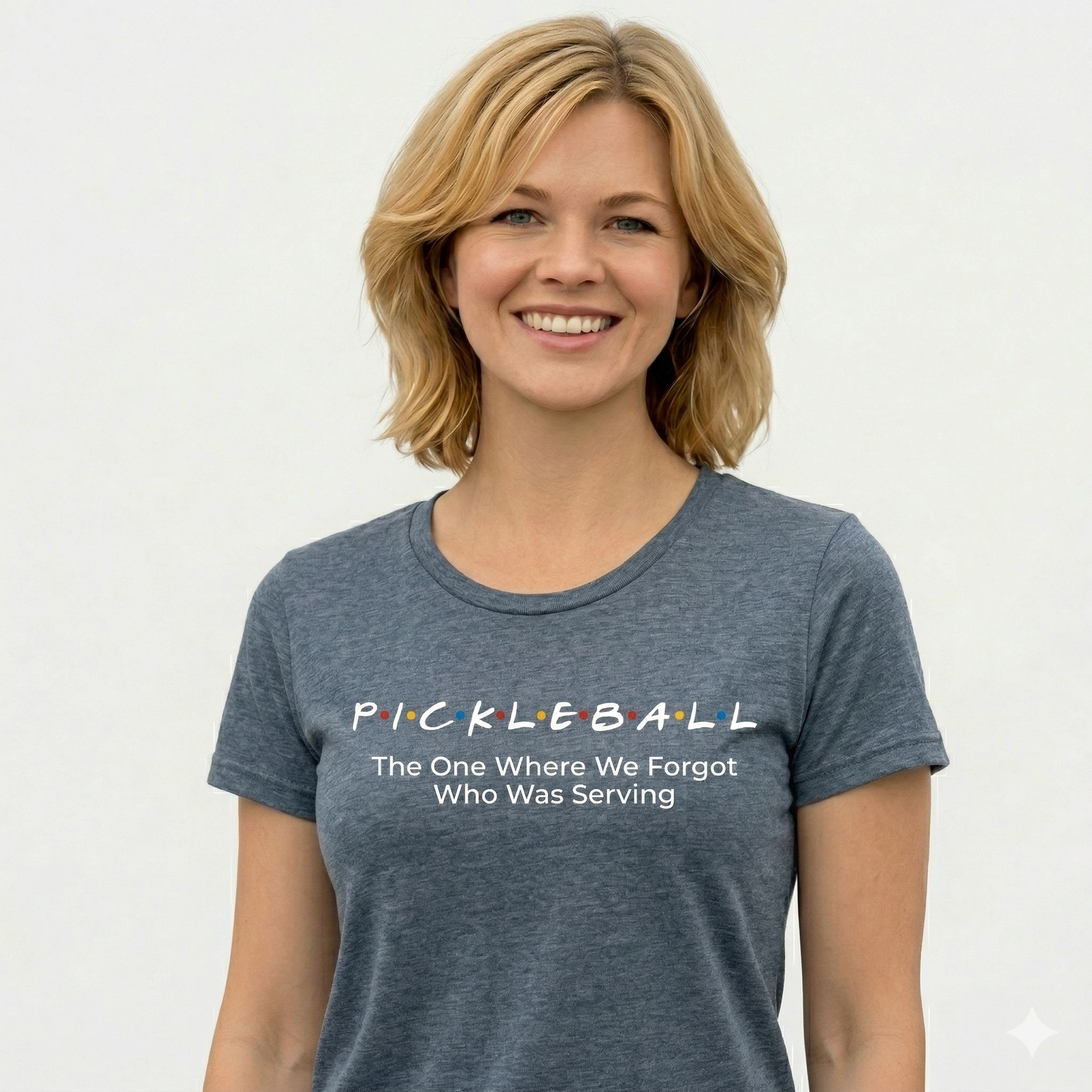 Woman wearing a blue t-shirt with pickleball humorous text design on a white background