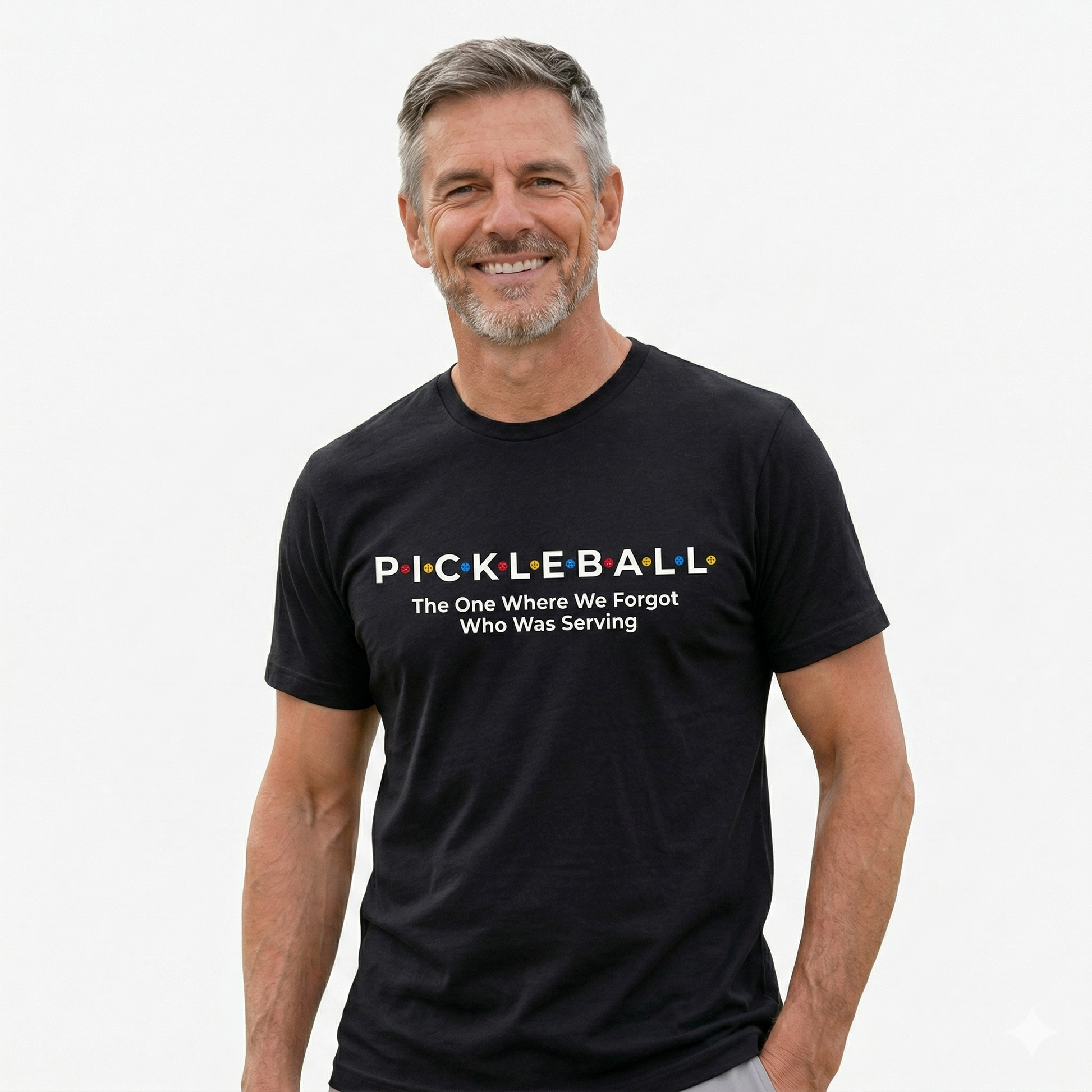 Man wearing a black t-shirt with pickleball-themed text on a white background