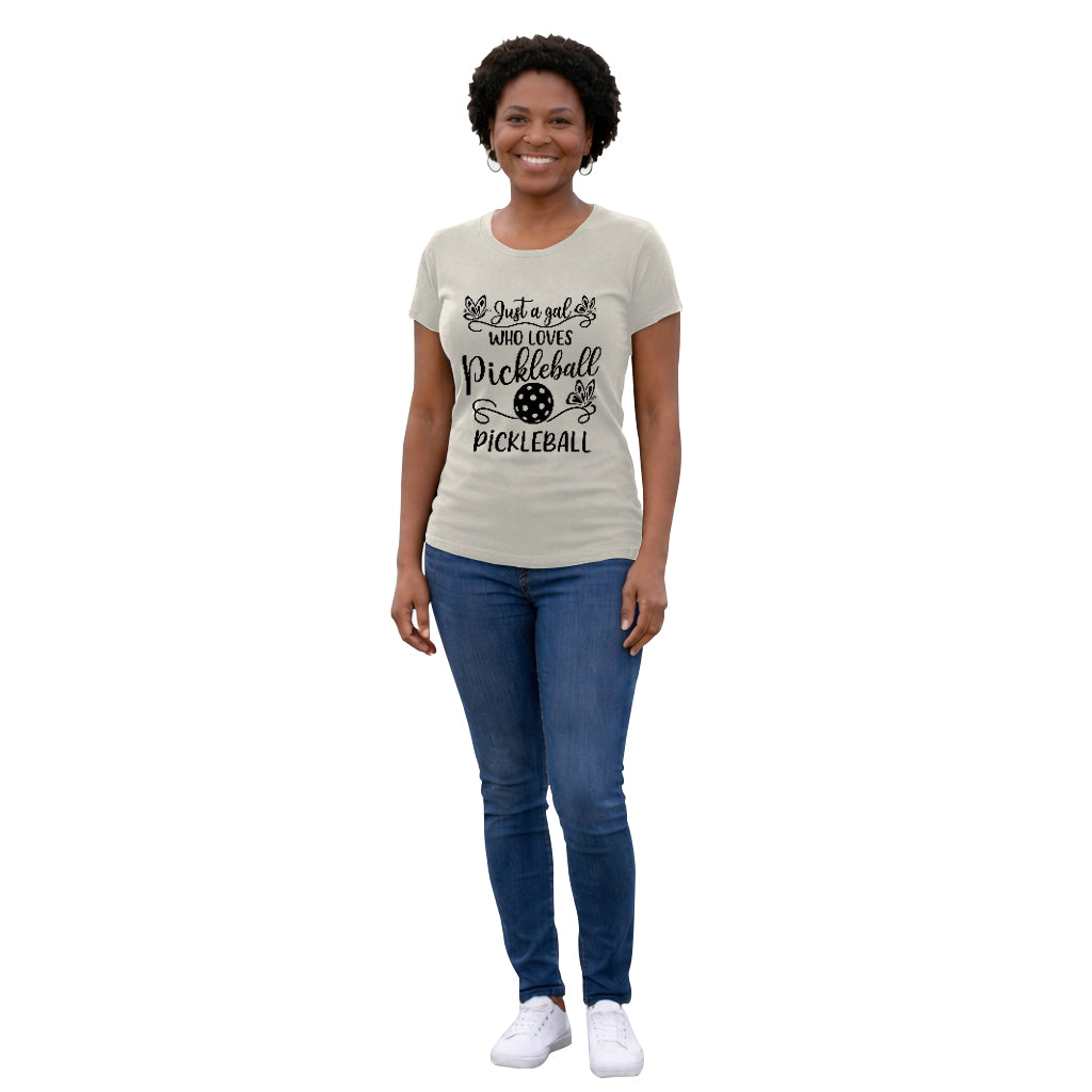 Person wearing a cream t-shirt with pickleball design and text on a white background