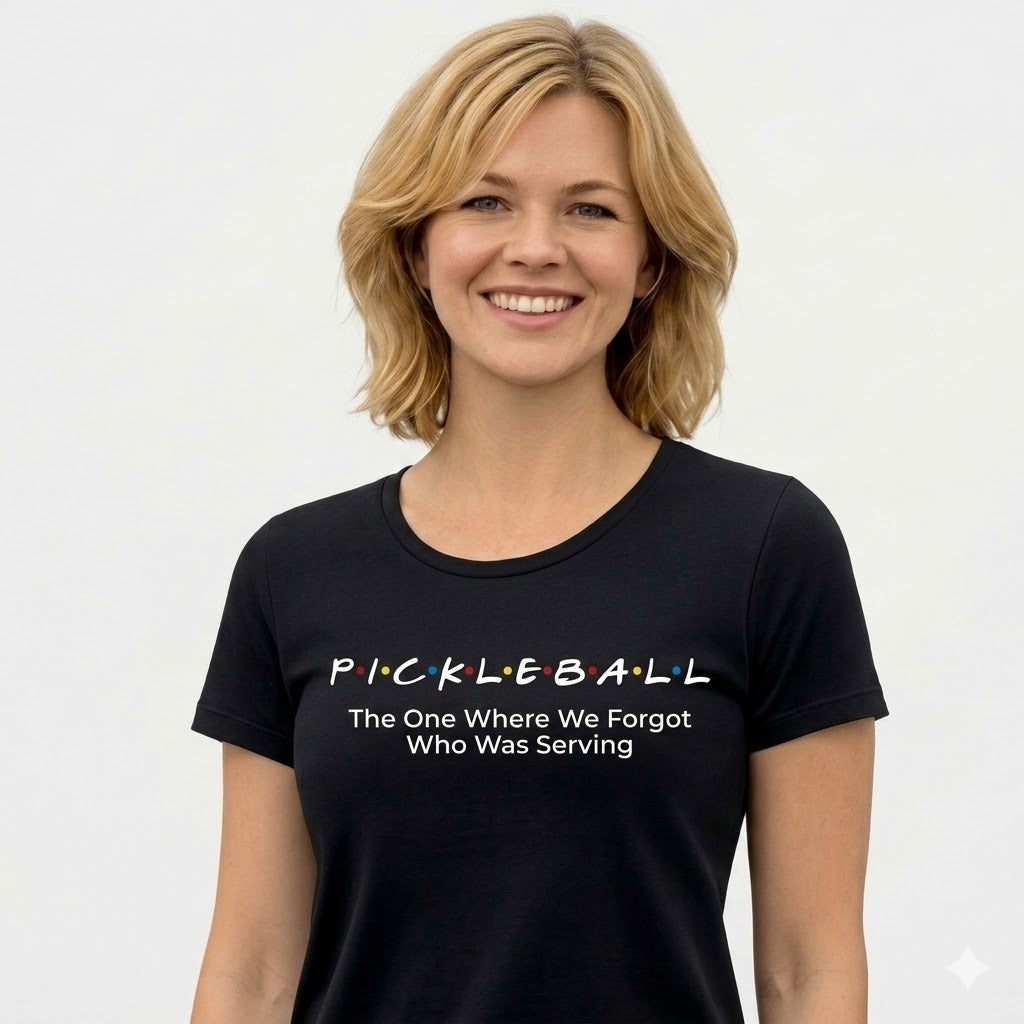 Woman wearing a black t-shirt with pickleball text on a white background