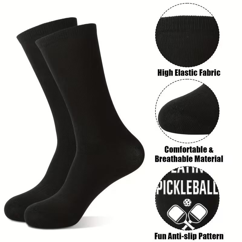A pair of black crew socks shown on a white background with three circular detail callouts and text reading 'High Elastic Fabric,' 'Comfortable & Breathable Material,' and 'Fun Anti-slip Pattern.'.