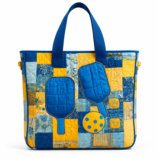 Blue and yellow quilted pickleball tote bag with paddle and ball appliqué on white