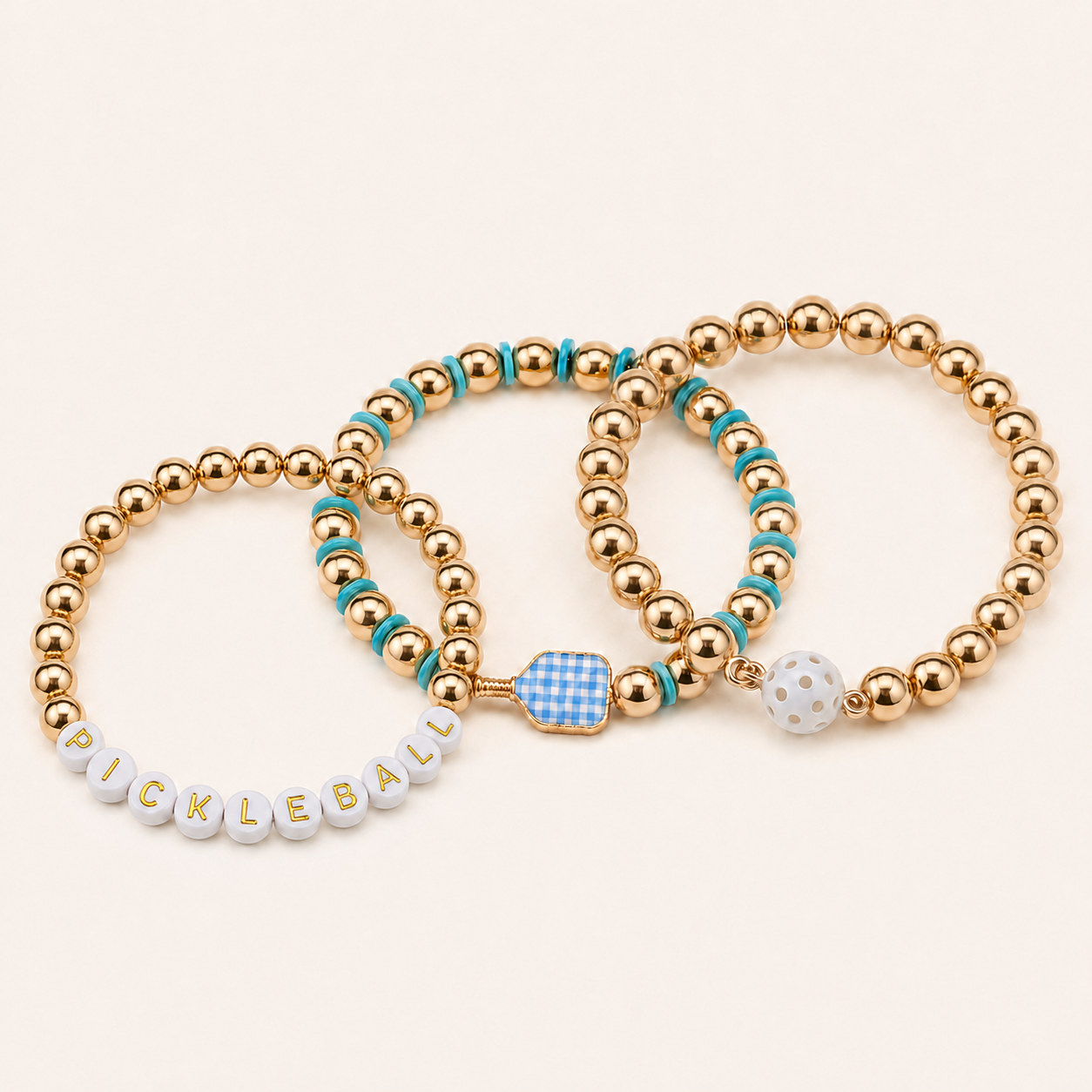 Three colorful pickleball stretch bracelets on a white background