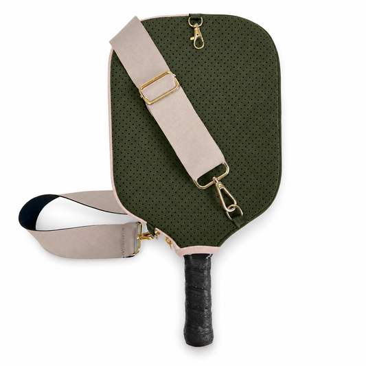 Olive green perforated pickleball paddle cover with beige crossbody strap and gold hardware on a white background