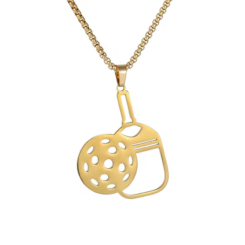 A gold pendant necklace featuring a stylized cutout design combining a perforated round disc and a rectangular frame, suspended from a gold box chain against a plain white background.