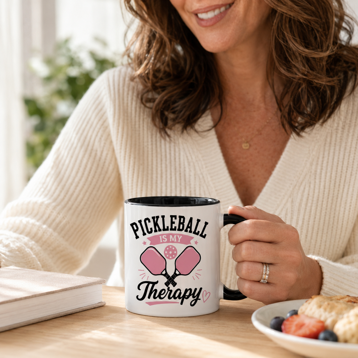 Woman enjoying morning coffee in a Pickleball Is My Therapy ceramic mug