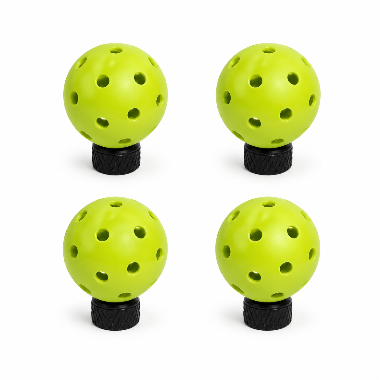 Four green pickleball tire valve caps for Schrader valves on a white background