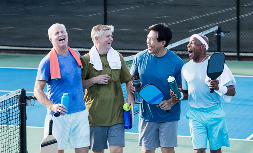 Players using Pickleball Twist challenge cards on court