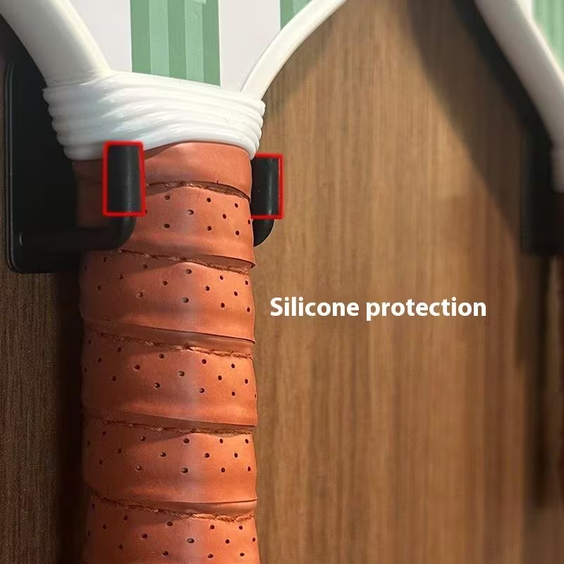 Close-up of wall-mounted pickleball paddle rack silicone protection